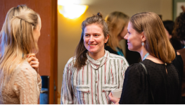 Three women talking and smiling